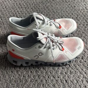On Clouds Running White and Orange Athletic Shoes